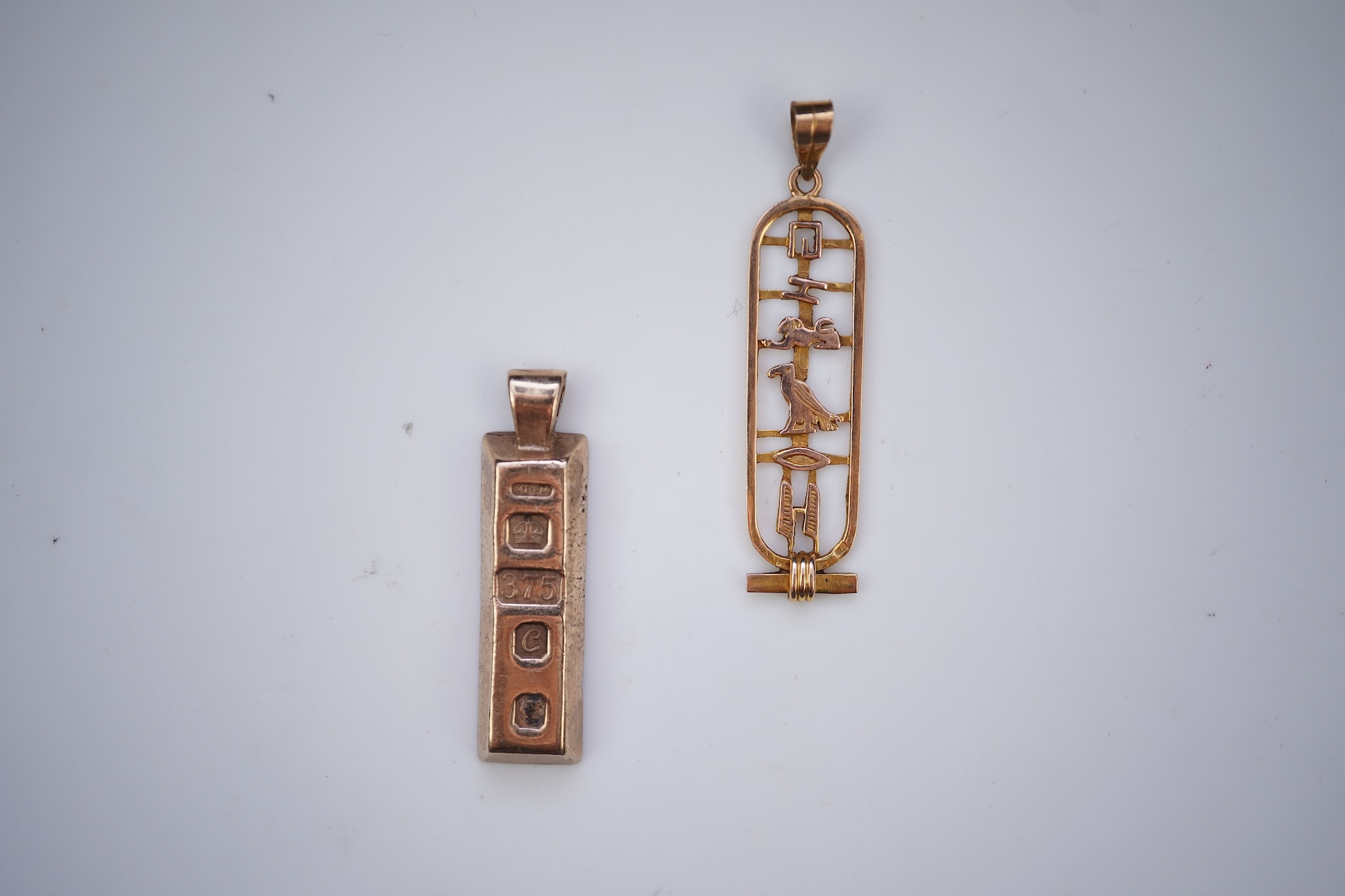 Two gold pendants
